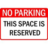 Sign no parking this space is reserved